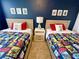 Charming bedroom featuring Star Wars themed bedding, decor, and blue accent wall, creating a fun and inviting space at 4441 Shiva Loop, Kissimmee, FL 34746