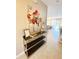 Entryway with console table, decorative accents, and a view of the dining room at 4441 Shiva Loop, Kissimmee, FL 34746