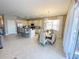 Open-concept kitchen with breakfast bar, dining area, stainless steel appliances at 4441 Shiva Loop, Kissimmee, FL 34746