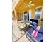 Outdoor patio with comfortable seating, ceiling fans, and access to the pool area, perfect for relaxation and entertainment at 4441 Shiva Loop, Kissimmee, FL 34746