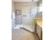 Bright bathroom featuring a glass enclosed shower with tile surround, offering a clean and modern design at 4441 Shiva Loop, Kissimmee, FL 34746