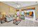 Comfortable living room with tile flooring and sliding glass doors to the patio at 4726 Ormond Beach Way, Kissimmee, FL 34746