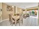 Open living and dining area with access to patio and ample natural light at 4726 Ormond Beach Way, Kissimmee, FL 34746