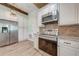 Gourmet kitchen featuring stainless steel appliances, granite countertops, and a unique wood ceiling at 4850 Wren Dr, St Cloud, FL 34772