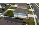Aerial view of the house showcasing its roof, backyard, and the fence around it at 606 Bell Prairie Cir, Lake Wales, FL 33859