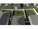 Aerial view of the house showcasing its roof, backyard, and the fence around it at 606 Bell Prairie Cir, Lake Wales, FL 33859