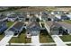 Community aerial view showing the house with a spacious backyard and surrounding neighborhood at 606 Bell Prairie Cir, Lake Wales, FL 33859