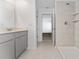 Bathroom with modern vanity, walk-in shower and neutral tones at 606 Bell Prairie Cir, Lake Wales, FL 33859