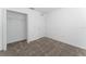 Comfortable carpeted bedroom with closet, perfect for a peaceful night's sleep and organized storage at 606 Bell Prairie Cir, Lake Wales, FL 33859