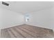 Well-lit bedroom with neutral carpeting and a window at 606 Bell Prairie Cir, Lake Wales, FL 33859