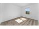 This carpeted bedroom has natural light through a window, creating a bright and inviting atmosphere at 606 Bell Prairie Cir, Lake Wales, FL 33859