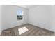 Well-lit bedroom with plush carpeting and a window at 606 Bell Prairie Cir, Lake Wales, FL 33859
