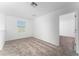 Bright carpeted bedroom with a window letting in natural light, creating a welcoming and comfortable space at 606 Bell Prairie Cir, Lake Wales, FL 33859