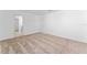 Carpeted bedroom featuring a closet and easy access to a bathroom down the hall, ideal for rest and relaxation at 606 Bell Prairie Cir, Lake Wales, FL 33859