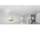 Open-concept living room with tile flooring and kitchen view at 606 Bell Prairie Cir, Lake Wales, FL 33859