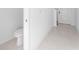 Clean powder room featuring a sleek toilet and tile flooring at 606 Bell Prairie Cir, Lake Wales, FL 33859