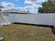 This fenced backyard offers a private outdoor space for relaxation and entertaining, surrounded by lush greenery at 633 Kangaroo Dr, Kissimmee, FL 34759