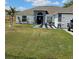 Beautiful home with well-manicured lawn, cute decor, and lovely curb appeal at 633 Kangaroo Dr, Kissimmee, FL 34759