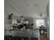 Well-lit kitchen featuring stainless steel appliances, tile floor and breakfast table with chairs at 633 Kangaroo Dr, Kissimmee, FL 34759