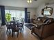 Formal dining and living room offers tile floors, comfortable seating and natural light at 633 Kangaroo Dr, Kissimmee, FL 34759