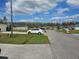 A quiet neighborhood street view showcasing well-maintained homes, lush lawns, and the property's convenient location at 633 Kangaroo Dr, Kissimmee, FL 34759