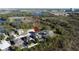 An aerial view shows a residential neighborhood with screened-in pools, solar panels, and lush landscaping, with a red pin marker at 802 Suffolk Pl, Davenport, FL 33896