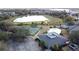 Aerial view of community amenities including a tennis court and a refreshing community pool at 802 Suffolk Pl, Davenport, FL 33896