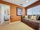 Cozy bedroom featuring carpeted floors, a unique daybed, and a peek into an adjoining room at 802 Suffolk Pl, Davenport, FL 33896