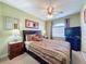 Bedroom featuring carpet, neutral walls, a ceiling fan and a TV at 802 Suffolk Pl, Davenport, FL 33896