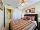 Bedroom includes an ensuite bathroom and closet with art at 802 Suffolk Pl, Davenport, FL 33896