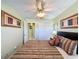 The bedroom includes art, a closet and ensuite bathroom at 802 Suffolk Pl, Davenport, FL 33896