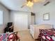 Shared bedroom with carpet, ceiling fan, and generous closet space for optimal storage at 802 Suffolk Pl, Davenport, FL 33896