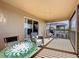 Relaxing outdoor patio with a mosaic-tiled table and comfortable seating arrangements at 802 Suffolk Pl, Davenport, FL 33896