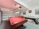 Finished garage game room features a pool table, foosball table, and an air hockey table, perfect for entertaining guests at 802 Suffolk Pl, Davenport, FL 33896
