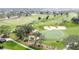 Scenic aerial of a well-manicured golf course featuring lush greens, sand traps and mature trees at 802 Suffolk Pl, Davenport, FL 33896