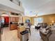 Open layout with kitchen flowing into the living room offering seamless entertaining at 802 Suffolk Pl, Davenport, FL 33896