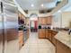 Kitchen features stainless steel appliances, granite countertops and a seamless flow at 802 Suffolk Pl, Davenport, FL 33896
