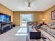 Inviting living room with sliding glass doors to the pool area providing lots of natural light at 802 Suffolk Pl, Davenport, FL 33896