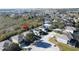 Aerial view of a neighborhood street lined with well-maintained homes with green lawns at 802 Suffolk Pl, Davenport, FL 33896