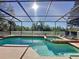 Sparkling pool and jacuzzi area enclosed for year-round enjoyment, ideal for relaxation at 802 Suffolk Pl, Davenport, FL 33896