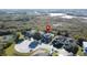Aerial view showing the location of suburban homes near a beautiful wetland preserve in the background at 802 Suffolk Pl, Davenport, FL 33896