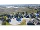 Street view of suburban homes on a sunny day with a beautiful wetland preserve in the background at 802 Suffolk Pl, Davenport, FL 33896