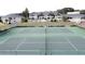 Aerial view of two well-maintained tennis courts within a gated community at 802 Suffolk Pl, Davenport, FL 33896
