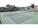 Aerial view of two well-maintained tennis courts near other community features at 802 Suffolk Pl, Davenport, FL 33896