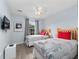 bedroom featuring two beds, fun decor, and a window with natural light at 8517 Crystal Cove Loop, Kissimmee, FL 34747