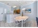 Bright dining area with a modern table setting, open to the kitchen, and plenty of natural light at 8517 Crystal Cove Loop, Kissimmee, FL 34747