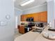 Well-maintained kitchen with stainless steel appliances, light oak cabinetry, and neutral countertops at 8517 Crystal Cove Loop, Kissimmee, FL 34747