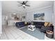 Bright living room with modern furniture, stylish decor, and ample space, adjacent to the kitchen area at 8517 Crystal Cove Loop, Kissimmee, FL 34747