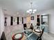 Dining room featuring modern decor, natural light, and seamless flow to the living spaces at 876 Lobster Ct, Kissimmee, FL 34744