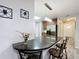 Kitchen peninsula with granite countertop and three bar stools at 876 Lobster Ct, Kissimmee, FL 34744